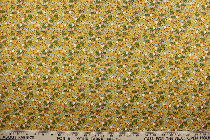 Flora features an intricately-detailed floral print comprised of pink, yellow, blue, green, and white on a cheerful marigold yellow background. This timeless design is perfect for adding a pop of color to any room.  The high-quality cotton material ensures lasting durability and softness, making it perfect for your next quilting or stitching project.  The versatile lightweight fabric is soft and easy to sew.  It would be great for apparel, quilting, crafting and sewing projects.  