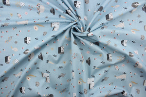 Happy Home is a whimsical house print featuring trees, flowers, rabbits, and hats in varying shades of pink, white, black, gray, and red against a soft blue background. Perfect for any living space, it is sure to bring a splash of joy to your home. The high-quality cotton material ensures lasting durability and softness. The versatile lightweight fabric is soft and easy to sew.  It would be great for apparel, quilting, crafting and sewing projects.  