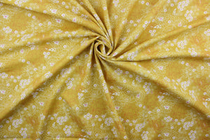  Serendipity is a cheerful floral pattern with its pink and white flowers against a yellow background.  It will add a touch of warmth to any room.  The high-quality cotton material ensures lasting durability and softness, making it perfect for your next quilting or stitching project.  The versatile lightweight fabric is soft and easy to sew.  It would be great for apparel, quilting, crafting and sewing projects.  