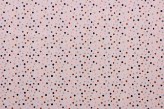 Dotty is a vibrant quilted fabric featuring pink, light blue, black, brown, and tan polka dots against a blush-colored background. The high-quality cotton material ensures lasting durability and softness, making it perfect for your next quilting or stitching project.  The versatile lightweight fabric is soft and easy to sew.  It would be great for apparel, quilting, crafting and sewing projects.  