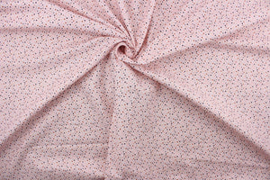 Dotty is a vibrant quilted fabric featuring pink, light blue, black, brown, and tan polka dots against a blush-colored background. The high-quality cotton material ensures lasting durability and softness, making it perfect for your next quilting or stitching project.  The versatile lightweight fabric is soft and easy to sew.  It would be great for apparel, quilting, crafting and sewing projects.  