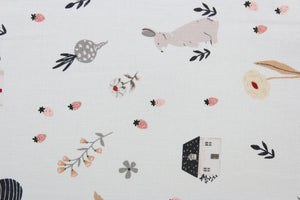 Happy Home is a whimsical house print featuring trees, flowers, rabbits, and hats in varying shades of pink, white, black, gray, and red against a white background.  Perfect for any living space, it is sure to bring a splash of joy to your home. The high-quality cotton material ensures lasting durability and softness. The versatile lightweight fabric is soft and easy to sew.  It would be great for apparel, quilting, crafting and sewing projects.  