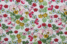 Load image into Gallery viewer, Flower Girl features a bright and cheerful floral print in a range of colors: mustard yellow, green, red, pink, blue and black on a white background.  The high-quality cotton material ensures lasting durability and softness, making it perfect for your next quilting or stitching project.  The versatile lightweight fabric is soft and easy to sew.  It would be great for apparel, quilting, crafting and sewing projects.  
