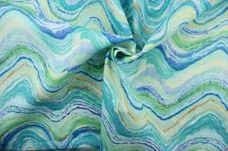 Farenor is a multi-purpose outdoor fabric featuring a wavy design in shades of blue and green, yellow, tan, and white. It is water and stain-resistant and offers U/V fade resistance up to 1,000 hours, making it a long-lasting and reliable fabric for all your outdoor needs.  Great for poolside or porches.  Uses include cushions, tablecloths, upholstery projects, decorative pillows and craft projects. 