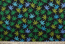 Load image into Gallery viewer, Herbal in Mix is a unique, four-color pattern featuring marijuana leaves over a black background. The vivid colors of turquoise, sky blue and green are sure to stand out.  The high-quality cotton material ensures lasting durability and softness.  It would be great for apparel, quilting, crafting and sewing projects.  
