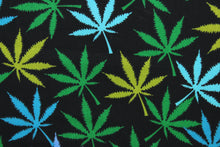 Load image into Gallery viewer, Herbal in Mix is a unique, four-color pattern featuring marijuana leaves over a black background. The vivid colors of turquoise, sky blue and green are sure to stand out.  The high-quality cotton material ensures lasting durability and softness.  It would be great for apparel, quilting, crafting and sewing projects.  
