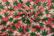 Load image into Gallery viewer,  Sky High showcases lush green marijuana leaves in contrast to a vivid red, orange and white background, this design packs plenty of personality.  The high-quality cotton material ensures lasting durability and softness.  It would be great for apparel, quilting, crafting and sewing projects.  
