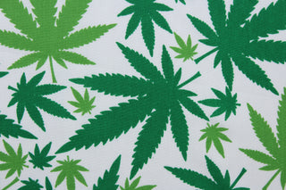  Ganja in Green is perfect for any cannabis enthusiast.  Featuring various sized marijuana leaves in a classic green against a white background, this design packs plenty of personality.  The high-quality cotton material ensures lasting durability and softness.  It would be great for apparel, quilting, crafting and sewing projects.  