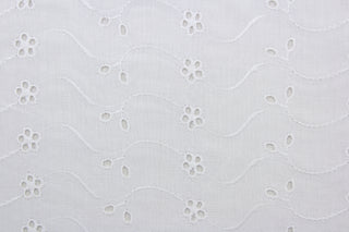 This beautiful embroidered eyelet fabric in white features dainty flowers and provides elegance and sophistication to your apparel, bedding, curtains, pillows, and/or home décor. Its unique design ensures a lasting charm in any room.