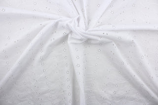 This beautiful embroidered eyelet fabric in white features dainty flowers and provides elegance and sophistication to your apparel, bedding, curtains, pillows, and/or home décor. Its unique design ensures a lasting charm in any room.