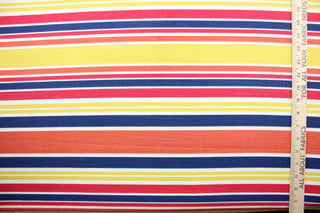 Robert Allen© Mod Layout in Fiesta is a multi-purpose fabric that features vivid, multicolored stripes in shades of red, orange, blue, yellow, and white.  The fabric is treated with a soil and stain repellant finish to ensure long lasting durability, with a rating of 30,000 double rubs.  It can be used for several different statement projects including window accents (drapery, curtains and swags), toss pillows, headboards, bed skirts, duvet covers and upholstery. 