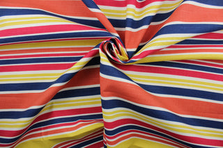 Robert Allen© Mod Layout in Fiesta is a multi-purpose fabric that features vivid, multicolored stripes in shades of red, orange, blue, yellow, and white.  The fabric is treated with a soil and stain repellant finish to ensure long lasting durability, with a rating of 30,000 double rubs.  It can be used for several different statement projects including window accents (drapery, curtains and swags), toss pillows, headboards, bed skirts, duvet covers and upholstery. 