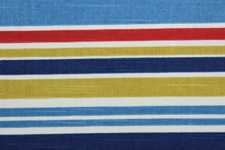 Robert Allen© Mod Layout in Fiesta is a multi-purpose fabric that features multicolored stripes in shades of blue, red, white, and mustard yellow.  The fabric is treated with a soil and stain repellant finish to ensure long lasting durability, with a rating of 30,000 double rubs.  It can be used for several different statement projects including window accents (drapery, curtains and swags), toss pillows, headboards, bed skirts, duvet covers and upholstery. 