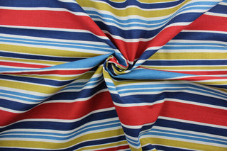 Robert Allen© Mod Layout in Fiesta is a multi-purpose fabric that features multicolored stripes in shades of blue, red, white, and mustard yellow.  The fabric is treated with a soil and stain repellant finish to ensure long lasting durability, with a rating of 30,000 double rubs.  It can be used for several different statement projects including window accents (drapery, curtains and swags), toss pillows, headboards, bed skirts, duvet covers and upholstery. 