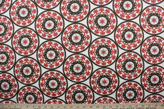 The Robert Allen© Suzani in Poppy is a multi-purpose fabric with a large medallion pattern featuring poppy, brown and putty shades against a white background. The fabric is soil and stain repellant, as well as 30,000 double rubs for durability.  Perfect for creating a stylish and timeless design.  It can be used for several different statement projects including window accents (drapery, curtains and swags), toss pillows, headboards, bed skirts, duvet covers and upholstery. 