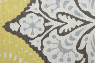 Robert Allen© Kavali in Dandelion fabric is a multi-purpose fabric with a geometric print in yellow, white, brown, and light blue/gray.  It features excellent durability with a 65,000 double rub rating.  It can be used for several different statement projects including window accents (drapery, curtains and swags), toss pillows, headboards, bed skirts, duvet covers and upholstery. 