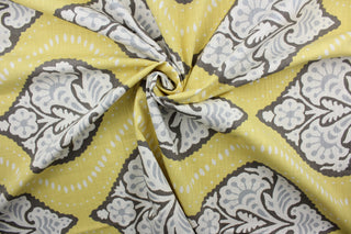 Robert Allen© Kavali in Dandelion fabric is a multi-purpose fabric with a geometric print in yellow, white, brown, and light blue/gray.  It features excellent durability with a 65,000 double rub rating.  It can be used for several different statement projects including window accents (drapery, curtains and swags), toss pillows, headboards, bed skirts, duvet covers and upholstery. 