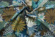 Load image into Gallery viewer, The Robert Allen© Zomper in Aegean Upholstery Fabric is a beautiful fabric featuring a large floral print in blues, greens, browns, khaki, and white. The soil and stain repellent finish make it suitable for any environment, and its durability rating of 100,000 double rubs ensures it will withstand the test of time.  It can be used for several different statement projects including window accents (drapery, curtains and swags), toss pillows, headboards, bed skirts, duvet covers and upholstery. 
