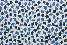 Load image into Gallery viewer,  Featuring a small floral print with shades of blue against a white background, this material is sure to be a conversation starter.  Its 100,000 double rubs, plus soil and stain repellant finish, make it a practical and reliable choice for your next project.  It can be used for several different statement projects including window accents (drapery, curtains and swags), toss pillows, headboards, bed skirts, duvet covers, upholstery, and more.
