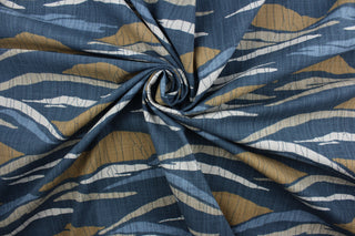 a multi purpose print featuring an array of hills in shades of slate, tan, blue, and beige to bring an understated beauty to any space.  Crafted with 65,000 double rubs, this fabric is exceptionally durable.  Additionally, a soil and stain repellant finish ensures that this fabric is easy to maintain.  It can be used for several different statement projects including window accents (drapery, curtains and swags), toss pillows, headboards, bed skirts, duvet covers, light duty upholstery, and more.