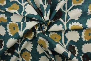  Robert Allen© Surreal Vines in Jewel fabric displays a large floral vine motif against a teal background.  Shades of tan, brown, and khaki can be seen among the vine details.  The fabric is soil and stain repellant, as well as 30,000 double rubs for durability.  It can be used for several different statement projects including window accents (drapery, curtains and swags), toss pillows, headboards, bed skirts, duvet covers, upholstery, and more.