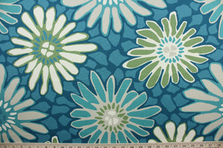 The Robert Allen© Tactile Bloom in Turquoise is a multi-use fabric with a large scale floral design featuring turquoise, white, and green. It is treated with soil and stain repellent finish for extended durability and boasts a 100,000 double rub rating.  It can be used for several different statement projects including window accents (drapery, curtains and swags), toss pillows, headboards, bed skirts, duvet covers and upholstery. 