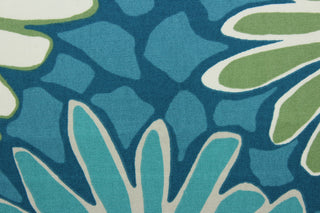 The Robert Allen© Tactile Bloom in Turquoise is a multi-use fabric with a large scale floral design featuring turquoise, white, and green. It is treated with soil and stain repellent finish for extended durability and boasts a 100,000 double rub rating.  It can be used for several different statement projects including window accents (drapery, curtains and swags), toss pillows, headboards, bed skirts, duvet covers and upholstery. 