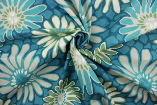 The Robert Allen© Tactile Bloom in Turquoise is a multi-use fabric with a large scale floral design featuring turquoise, white, and green. It is treated with soil and stain repellent finish for extended durability and boasts a 100,000 double rub rating.  It can be used for several different statement projects including window accents (drapery, curtains and swags), toss pillows, headboards, bed skirts, duvet covers and upholstery. 