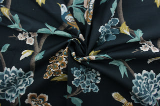 a multi-purpose fabric  designed with a large scale floral print featuring perched birds and butterflies in slate blue, pale pink, golden yellow, green, white, tan, and brown against an admiral blue background. The fabric is also incredibly durable, offering up to 30,000 double rubs.  It can be used for several different statement projects including window accents (drapery, curtains and swags), toss pillows, headboards, bed skirts, duvet covers, upholstery, and more.