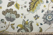 Load image into Gallery viewer,  a classic mottled floral and leaf print.  Its lovely aloe, brown, gray, midnight blue, and goldenrod colors blend beautifully against an ivory background, and it offers top-notch durability with 30,000 double rubs and stain and water repellent protection. It can be used for several different statement projects including window accents (drapery, curtains and swags), toss pillows, headboards, bed skirts, duvet covers, upholstery, and more.
