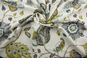 a classic mottled floral and leaf print.  Its lovely aloe, brown, gray, midnight blue, and goldenrod colors blend beautifully against an ivory background, and it offers top-notch durability with 30,000 double rubs and stain and water repellent protection. It can be used for several different statement projects including window accents (drapery, curtains and swags), toss pillows, headboards, bed skirts, duvet covers, upholstery, and more.