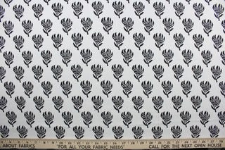 The Robert Allen© Lighten Up in Ebony is a multi-purpose linen fabric featuring an elegant ebony floral design against a crisp white background.  It can be used for several different statement projects including window accents (drapery, curtains and swags), toss pillows, bed skirts, home décor and more.