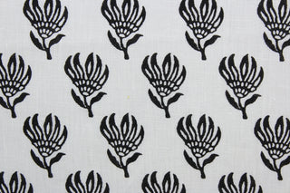 The Robert Allen© Lighten Up in Ebony is a multi-purpose linen fabric featuring an elegant ebony floral design against a crisp white background.  It can be used for several different statement projects including window accents (drapery, curtains and swags), toss pillows, bed skirts, home décor and more.