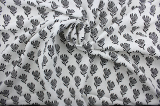 The Robert Allen© Lighten Up in Ebony is a multi-purpose linen fabric featuring an elegant ebony floral design against a crisp white background.  It can be used for several different statement projects including window accents (drapery, curtains and swags), toss pillows, bed skirts, home décor and more.