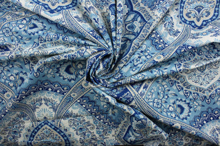 This multi-purpose fabric features a vibrant floral damask print with a mix of blue, tan, and white colors. Crafted with a soil and stain repellent finish, it's perfect for anything from drapery to upholstery.  It can be used for several different statement projects including window accents (drapery, curtains and swags), toss pillows, headboards, bed skirts, duvet covers, upholstery, and more.
