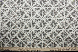 The Robert Allen© Gem Field in Birch is a multi-purpose fabric made with a geometric medallion print in brown and off white.  It has a durable construction with 100,000 double rubs and is soil and stain resistant.  It can be used for several different statement projects including window accents (drapery, curtains and swags), toss pillows, headboards, bed skirts, duvet covers, upholstery, and more.