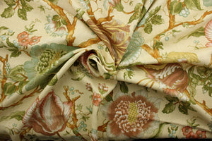 Featuring an intricate floral vine print, this fabric is a vibrant mix of coral, blue, green, yellow, and golden brown on a pale yellow background.  This fabric has a soil and stain repellant finish and has been tested to endure 6,000 double rubs. It can be used for several different statement projects including window accents (drapery, curtains and swags), toss pillows, headboards, bed skirts, duvet covers, upholstery, and more.