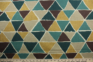 Robert Allen© Geometric in Forest is ideal for modern spaces. Featuring a contemporary geometric design with shades of green, gold, brown, and dark beige, it is perfect for making a statement. This multipurpose fabric is highly durable with 30,000 double rubs and a soil and stain resistant finish. It can be used for several different statement projects including window accents (drapery, curtains and swags), toss pillows, headboards, bed skirts, duvet covers, upholstery, and more.