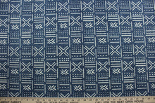 Load image into Gallery viewer, Richloom Solarium© Brevard in Indigo provides multi-purpose performance for outdoor use with a classic ethnic pattern in indigo and off white. Durable enough to withstand up to 500 hours of direct sunlight, it is also water and stain resistant.  Perfect for patio, deck and poolside.  It can be used for several different statement projects including cushions, upholstery projects and decorative pillows. 
