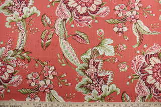 Featuring a stunning floral pattern in rust, terra cotta, green, purple, and brown, this fabric is sure to bring a vibrant touch to any space.  The coral background adds depth to the print, and it is finished with a soil and stain-resistant finish.  It can be used for several different statement projects including window accents (drapery, curtains and swags), toss pillows, headboards, bed skirts, duvet covers, upholstery, and more.