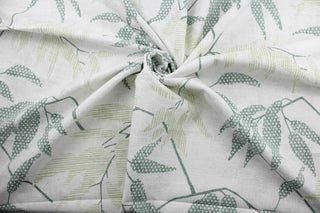 The Robert Allen© Enclave in Grassland fabric, a vision of earthy, natural beauty designed with multiuse versatility.  Boasting a bold botanical print in shades of green on a white/light gray background, this fabric offers 30,000 double rubs of durability and is soil and stain resistant.   It can be used for several different statement projects including window accents (drapery, curtains and swags), toss pillows, headboards, bed skirts, duvet covers, upholstery, and more.