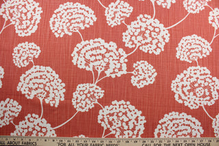  Robert Allen© Toile Stems in Coral is perfect for multi-use projects. This durable fabric features a large white floral print on a coral background and is crafted with 65,000 double rubs for added resilience.  It is also stain and odor resistant for longevity and easy care.  It can be used for several different statement projects including window accents (drapery, curtains and swags), toss pillows, headboards, bed skirts, duvet covers, upholstery, and more.