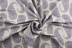 Create a statement piece with Robert Allen© Paisley Purple in Eggplant. This multi-purpose, high-end jacquard fabric features large paisley petals in shades of purple on an antique white background. It offers 30,000 double rubs and can be used for upholstery, cushions, pillows, and craft projects.