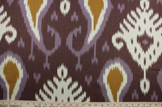  Bring a luxurious, exotic look to your home with Robert Allen© Batavia in Amethyst. This multi-use fabric features a large scale ikat print in eye-catching shades of violet, antique gold, off white, and eggplant.  It is also highly durable, boasting a 21,000 double rub rating and soil and stain resistance.  It can be used for several different statement projects including window accents (drapery, curtains and swags), toss pillows, headboards, bed skirts, duvet covers, upholstery, and more.