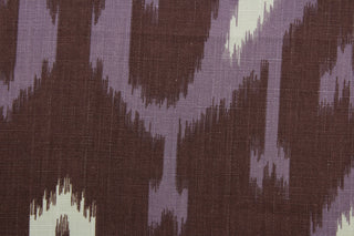  Bring a luxurious, exotic look to your home with Robert Allen© Batavia in Amethyst. This multi-use fabric features a large scale ikat print in eye-catching shades of violet, antique gold, off white, and eggplant.  It is also highly durable, boasting a 21,000 double rub rating and soil and stain resistance.  It can be used for several different statement projects including window accents (drapery, curtains and swags), toss pillows, headboards, bed skirts, duvet covers, upholstery, and more.