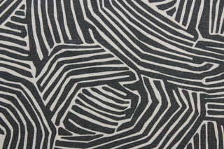 multi-use fabric with a stylish zebra print.  It features an eye-catching combination of charcoal and off white that will bring a modern touch to any room.  This fabric is incredibly durable with 95,000 double rubs of wear, and its soil and stain resistant surface makes it easy to clean and maintain.  It can be used for several different statement projects including window accents (drapery, curtains and swags), toss pillows, headboards, bed skirts, duvet covers, upholstery, and more.