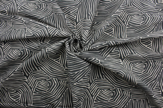 multi-use fabric with a stylish zebra print.  It features an eye-catching combination of charcoal and off white that will bring a modern touch to any room.  This fabric is incredibly durable with 95,000 double rubs of wear, and its soil and stain resistant surface makes it easy to clean and maintain.  It can be used for several different statement projects including window accents (drapery, curtains and swags), toss pillows, headboards, bed skirts, duvet covers, upholstery, and more.