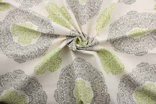 Introducing the Robert Allen© Slub Duck in Natural/Green to bring a stunning look to any space.  This multi-purpose fabric features a dramatic large scale medallion print in green and gray on a natural background.  Soil and stain resistant, it is designed to last and look great.  It can be used for several different statement projects including window accents (drapery, curtains and swags), toss pillows, headboards, bed skirts, duvet covers and upholstery. 