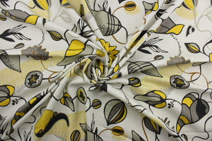 The Robert Allen© Magnus in Citrine features a retro wandering vines and leaf pattern in citrine, gray, black and brown on an ivory background.  This multi-purpose fabric offers excellent durability and performance, with a rating of 21,000 double rubs and soil and stain resistance.  It can be used for several different statement projects including window accents (drapery, curtains and swags), toss pillows, headboards, bed skirts, duvet covers, upholstery, and more.