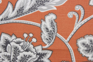  Robert Allen© McGivern in Orange fabric offers a vibrant, multi-purpose floral vine print on an orange background. The gray and white design is highlighted by a soil and stain repellant finish.  It can be used for several different statement projects including window accents (drapery, curtains and swags), toss pillows, headboards, bed skirts, duvet covers, upholstery, and more.